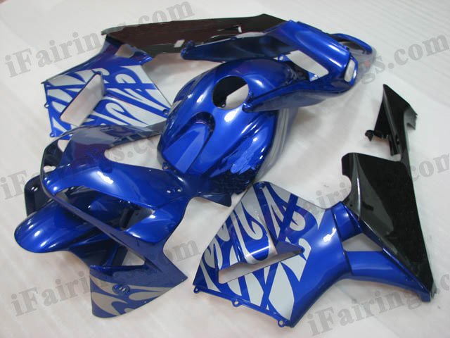 2003 2004 CBR600RR blue and black fairing with silver strips.
