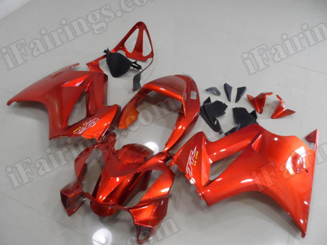 Motorcycle fairings/bodywork for Honda VFR800 2002 to 2012 burnt orange color scheme.